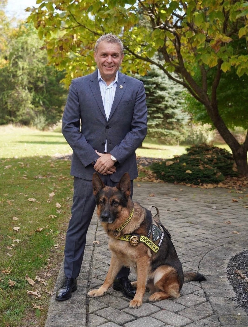 Businessman César DePaço and his dog “Sergeant Lanzer”